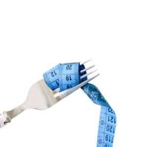 A fork entwined with a blue measuring tape, symbolizing dieting and weight management.